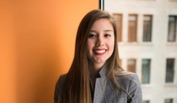 shallow focus photo of woman in gray jacket {{brizy_dc_image_alt imageSrc=